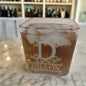 square on the rocks glass filled with whiskey and ice with the engraving "Dillon" on the side