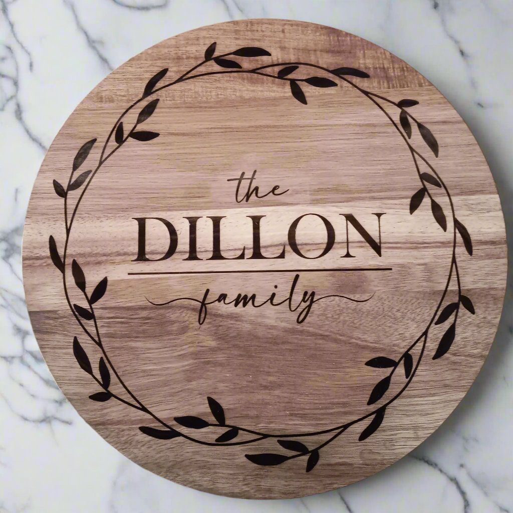 top of lazy suzan measuring 14" with border engraving and "the dillon family"