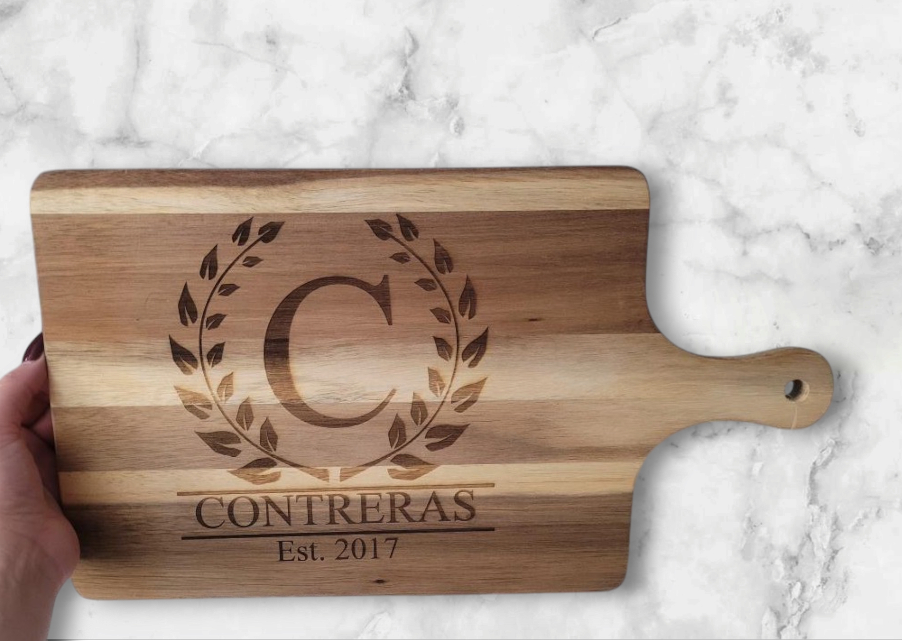 medium acacia cutting board with "contreras est. 2017" engraving