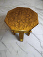 small end table with a large mandala engraved on the top