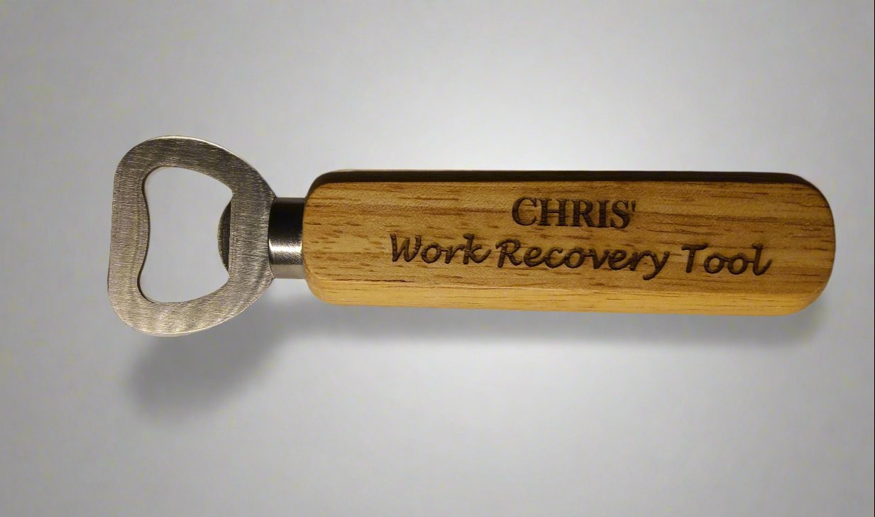 Wooden handled bottle opener with engraving of " Chris's Work Recovery Tool" on the handle